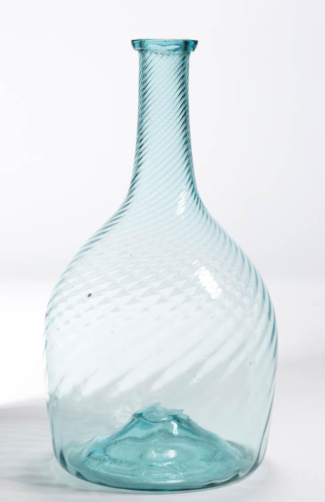 PATTERN-MOLDED BEEHIVE-FORM BOTTLE: PATTERN-MOLDED BEEHIVE-FORM BOTTLE, bright aquamarine, 25 ribs swirled tightly to the right, medium neck tapering slightly to an applied collared mouth, kick-up base with rough pontil mark. Midwestern
