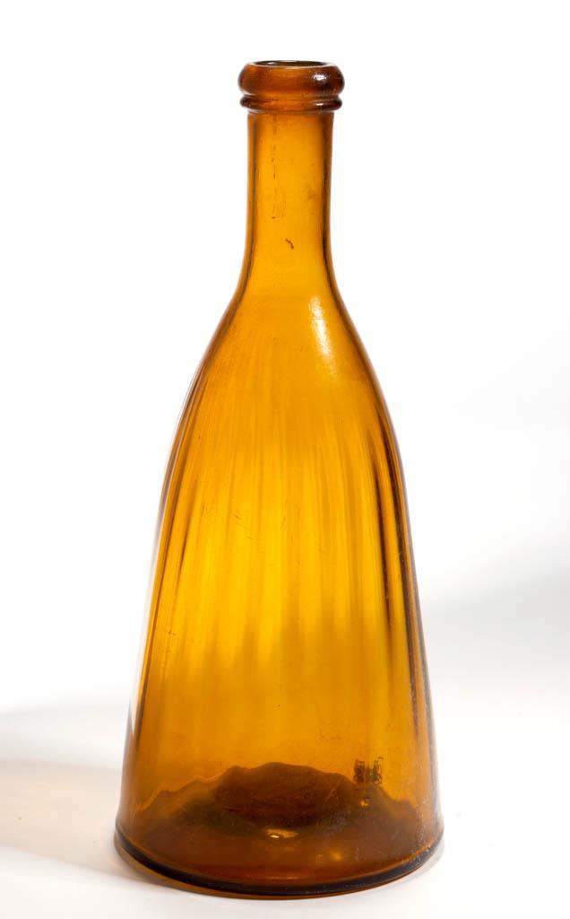 PATTERN-MOLDED TAPER-FORM BOTTLE: PATTERN-MOLDED TAPER-FORM BOTTLE, yellow topaz with amber tone, 26 vertical ribs ending below the medium neck, applied rounded mouth with lower collar, kick-up base with rough pontil mark. Probably Mi