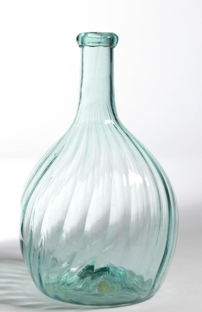 PATTERN-MOLDED GLOBULAR-FORM BOTTLE: PATTERN-MOLDED GLOBULAR-FORM BOTTLE, aquamarine, 24 ribs slightly swirled to the right, medium neck tapering slightly to an applied rounded mouth, kick-up base with rough pontil mark. Midwestern Unite