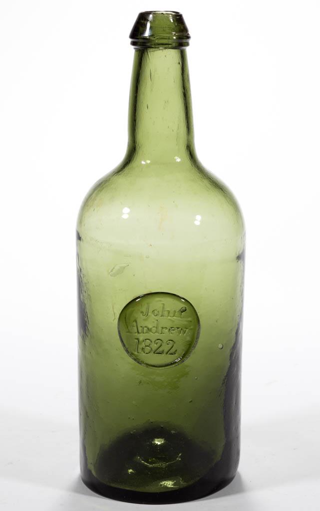 ENGLISH APPLIED SEAL WINE BOTTLE: ENGLISH APPLIED SEAL WINE BOTTLE, rare medium olive green, cylindrical form with short neck, applied circular seal embossed "John / Andrew / 1822" below shoulder, applied sloping mouth with lower coll