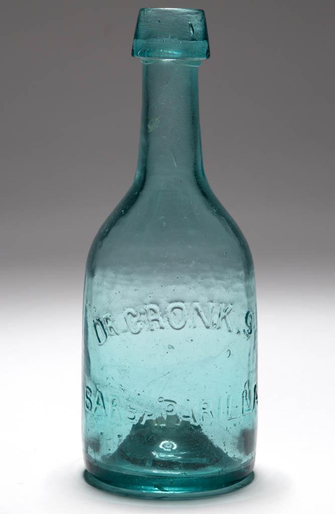 DR. CRONK'S SARSAPARILLA BOTTLE: DR. CRONK'S SARSAPARILLA BOTTLE, aquamarine, club form embossed "DR CRONK.S / SARSAPARILLA" on obverse and "NS. WHELLER" to reverse, applied broad sloping mouth, domed base with iron pontil mark. Nice