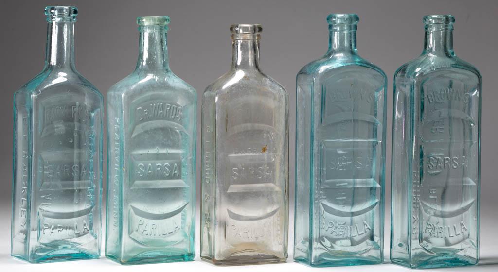 ASSORTED SARSAPARILLA BOTTLES, LOT OF FIVE: ASSORTED SARSAPARILLA BOTTLES, LOT OF FIVE, aquamarine and colorless, each rectangular form, embossed for B. F. Rackley, Dr. Wards, Hood's Compound Extract, and two Brown's, tooled mouths, plain bases