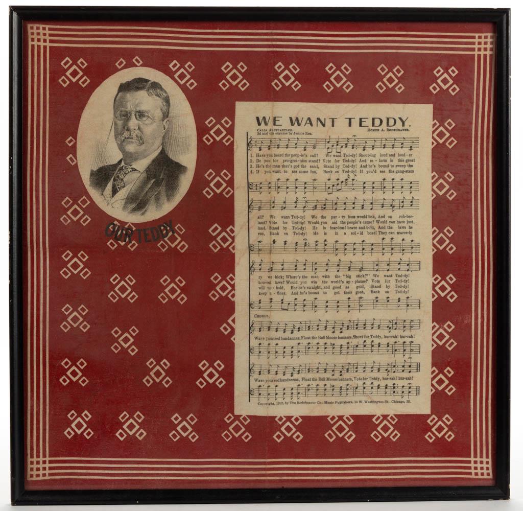1912 TEDDY ROOSEVELT CAMPAIGN BANDANA / HANDKERCHIEF: 1912 TEDDY ROOSEVELT CAMPAIGN BANDANA / HANDKERCHIEF, printed cotton, design featuring the sheet music for the campaign song "WE WANT TEDDY." by Homer A. Rodeheaver. Housed under glass in a modern fra