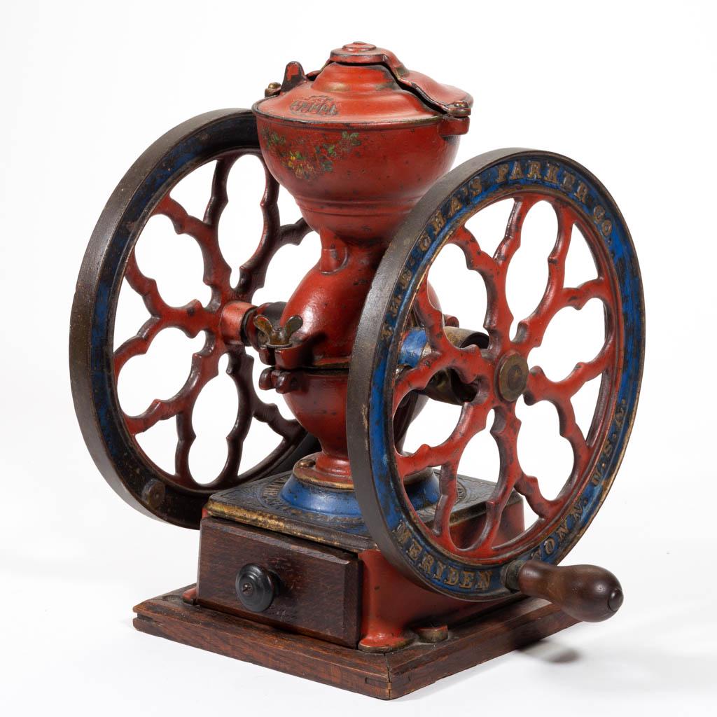 PARKER NO. 3000 CAST-IRON TWO-WHEEL COFFEE MILL /: PARKER NO. 3000 CAST-IRON TWO-WHEEL COFFEE MILL / GRINDER, swivel lid, original wooden base, paint, and decals. Chas. Parker Co., Meriden, CT. Fourth quarter 19th/early 20th century. 14 3/4" HOA, 10 3