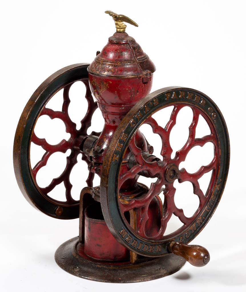 PARKER CAST-IRON TWO-WHEEL COFFEE MILL / GRINDER: PARKER CAST-IRON TWO-WHEEL COFFEE MILL / GRINDER, swivel lid with brass eagle finial, original paint and decals. Chas. Parker Co., Meriden, CT. Fourth quarter 19th/early 20th century. 16 1/2" HOA, 10 