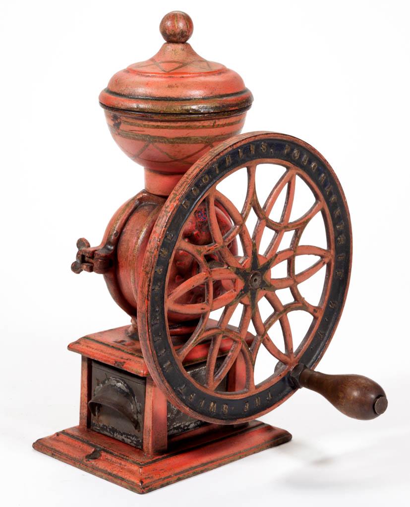 SWIFT NO. 12 CAST-IRON ONE-WHEEL COFFEE MILL / GRINDER: SWIFT NO. 12 CAST-IRON ONE-WHEEL COFFEE MILL / GRINDER, swivel lid, original paint and decal. Swift Mill Lane Brothers, Poughkeepsie, NY. Fourth quarter 19th/early 20th century. 14" HOA, 9" D wheel. G