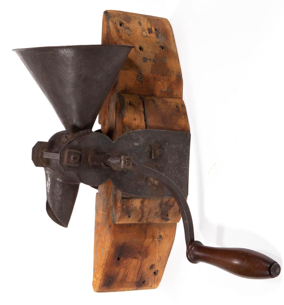 SIGNED WROUGHT-IRON POST-MOUNTED COFFEE MILL / GRINDER: SIGNED WROUGHT-IRON POST-MOUNTED COFFEE MILL / GRINDER, conical-form hopper, grinder support bolt impressed possibly "GF 10 C" and "H", hand-crank grinder with notched hardware. 19th century. 18" H, H