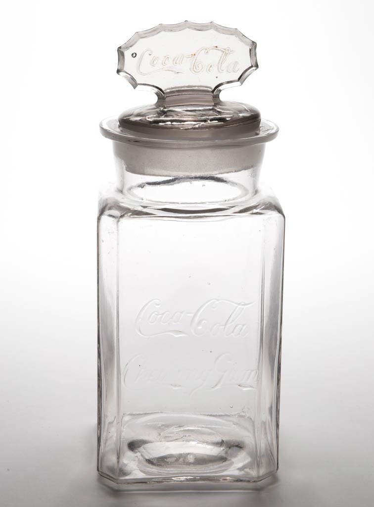 COCA-COLA CHEWING GUM ADVERTISING EMBOSSED GLASS STORE: COCA-COLA CHEWING GUM ADVERTISING EMBOSSED GLASS STORE JAR, with period appropriate cover, which sits slightly high. Circa 1905. 11 1/2" HOA. Excellent overall condition with minor roughness / small f