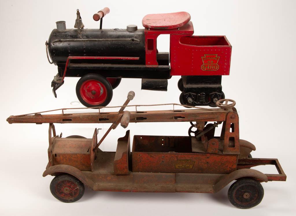 KEYSTONE PACKARD PRESSED-STEEL NO. 6400 RIDE-ON TRAIN: KEYSTONE PACKARD PRESSED-STEEL NO. 6400 RIDE-ON TRAIN TOY, with original paint and decals. Together with Keystone Ladder Truck. Two pieces total. Keystone Manufacturing Co., Boston, MA. Circa 1925. 25
