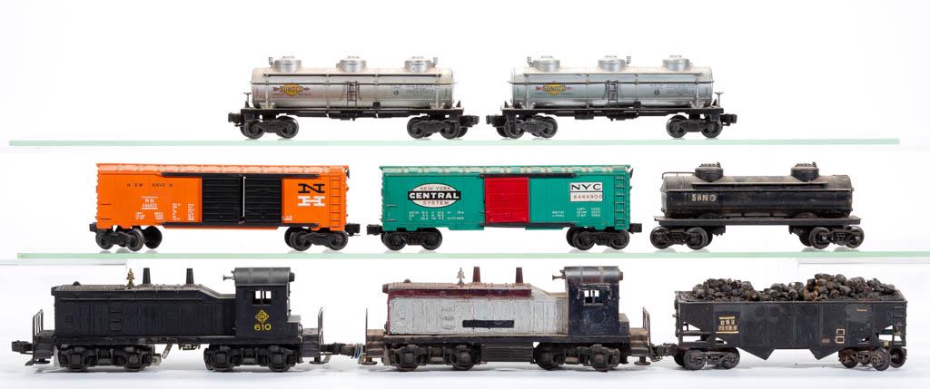 LIONEL O-GAUGE DIESEL SWITCHERS AND FREIGHT CARS, LOT: LIONEL O-GAUGE DIESEL SWITCHERS AND FREIGHT CARS, LOT OF 16, comprising two diesel switchers including a No. 610 Erie example and 14 various freight cars including a No. 6464-900 box car, two Sunoco o
