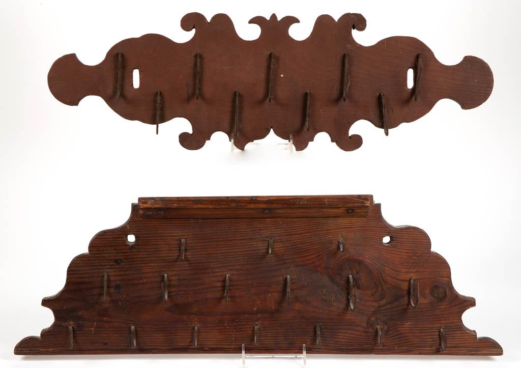 COUNTRY WOODEN GAME BOARDS, LOT OF TWO: COUNTRY WOODEN GAME BOARDS, LOT OF TWO, each board fitted with original wrought-iron hooks. One example retains an old red-painted surface. Late 18th/early 19th century. Red 9" HOA, 27 1/2" WOA. Very 