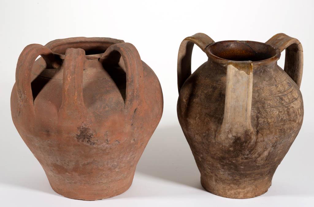 REDWARE / EARTHENWARE JARS, LOT OF TWO: REDWARE / EARTHENWARE JARS, LOT OF TWO, each having ovoid form, three strap handles, and incised shoulder rings, of unknown origin and age, one having lead-glazed interior. 11 3/4" HOA.Largest example