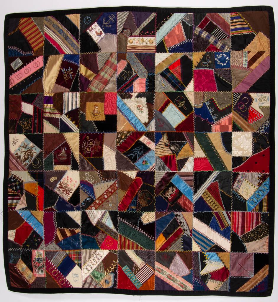 MID-ATLANTIC EMBROIDERED CRAZY QUILT: MID-ATLANTIC EMBROIDERED CRAZY QUILT, hand-stitched, 49 pattern blocks made of various fabrics, motifs including cats, owls, a ribbon with print of "The Baldwin", a Burlington County Agricultural Fair