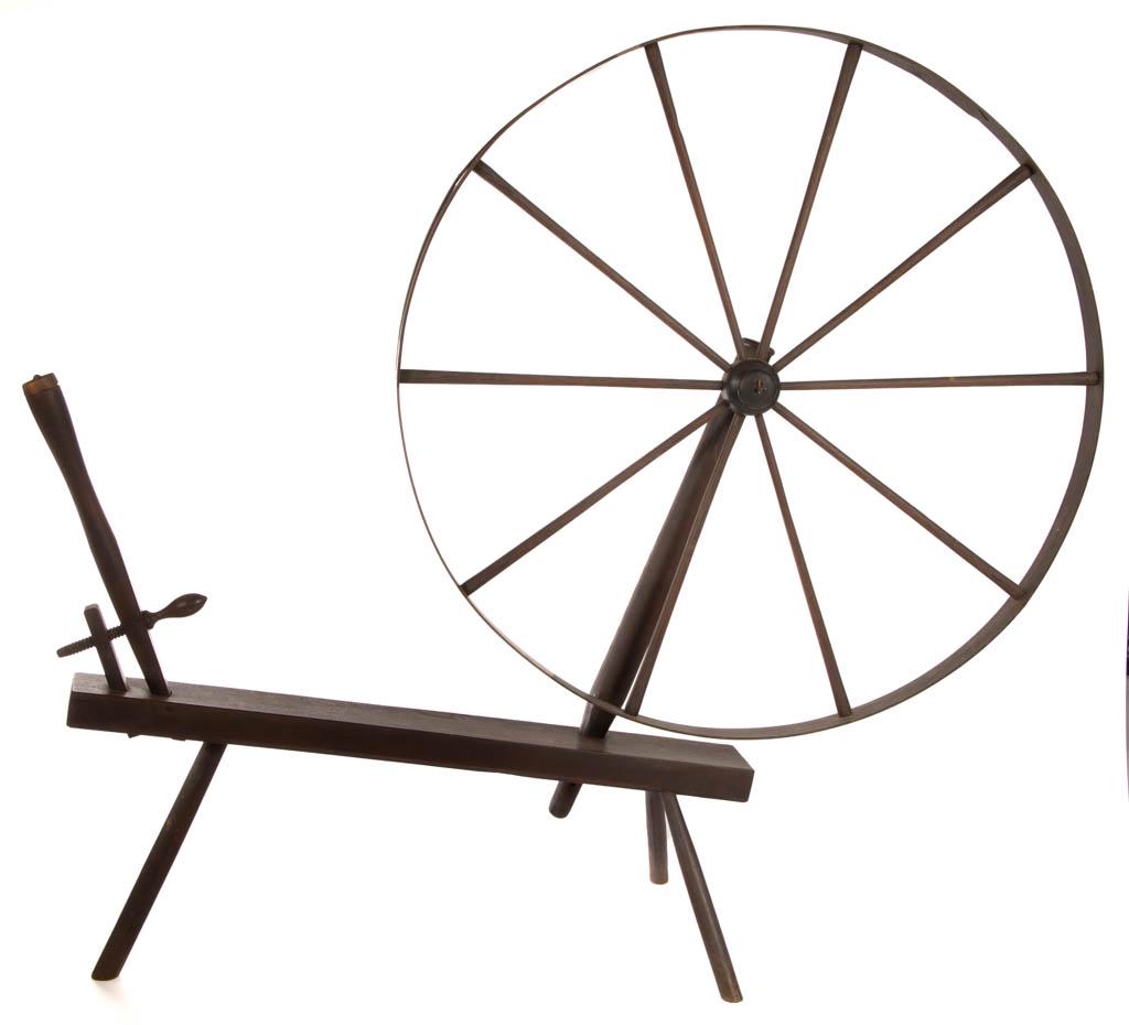 OAK WOOL WALKING / SPINNING WHEEL: OAK WOOL WALKING / SPINNING WHEEL, having simple turnings, screw tension, and a large wheel table possibly sycamore. Retains an old surface. First half 19th century. 45" D wheel, base 40 1/4" H, 48" L