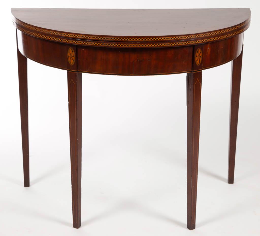 NEW ENGLAND FEDERAL INLAID CARD TABLE: NEW ENGLAND FEDERAL INLAID CARD TABLE, demilune hinged top, raised on three square-tapered legs with banded cuffs, one of which swings out to support the hinged leaf. Retains an old refinished surface