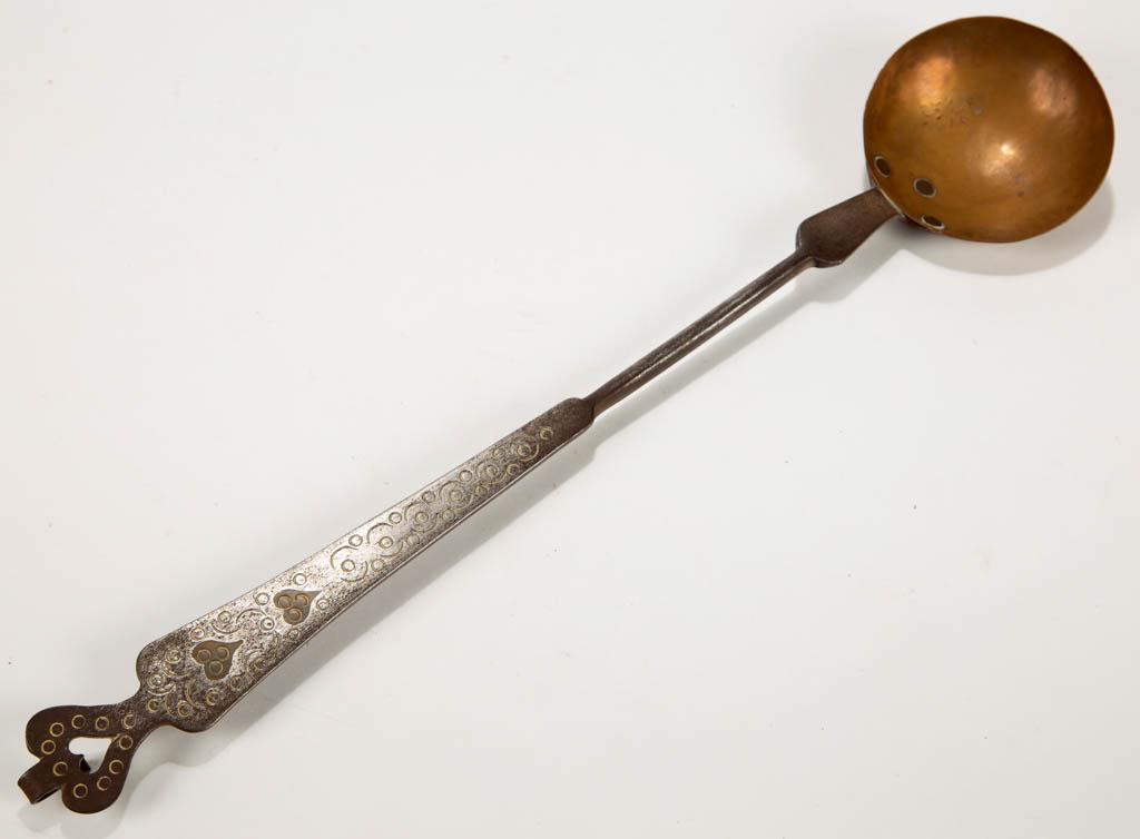 PENNSYLVANIA DECORATED WROUGHT-IRON AND COPPER WEDDING: PENNSYLVANIA DECORATED WROUGHT-IRON AND COPPER WEDDING LADLE, handle with cut-out heart terminal with hanging hook having a delicate curl, tapered grip with two inlaid brass hearts and punched circula