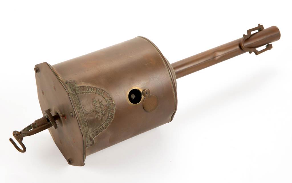 ENGLISH JOHN LINWOOD BRASS MECHANICAL HEARTH CLOCKWORKS: ENGLISH JOHN LINWOOD BRASS MECHANICAL HEARTH CLOCKWORKS SPIT / BOTTLE JACK, cylinder form with suspension hooks to each end, applied makers label, swing cover for key window, octagonal base plate impr