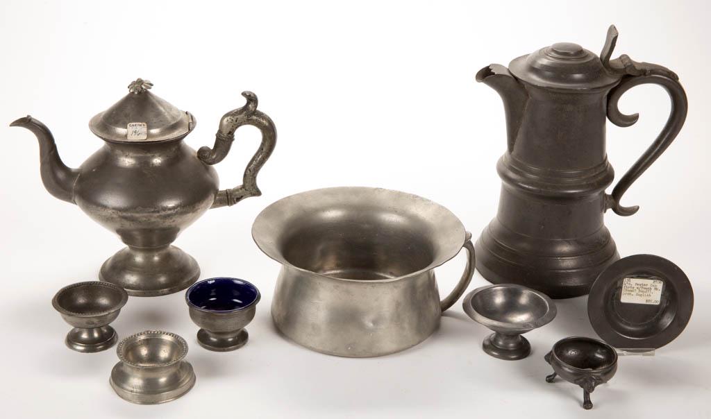 ASSORTED ENGLISH / AMERICAN PEWTER DOMESTIC ARTICLES,: ASSORTED ENGLISH / AMERICAN PEWTER DOMESTIC ARTICLES, LOT OF NINE, including an unmarked communion flagon, a teapot stamped on the underside "F. Porter / Westbrook" for Freeman Porter of Maine, and a 