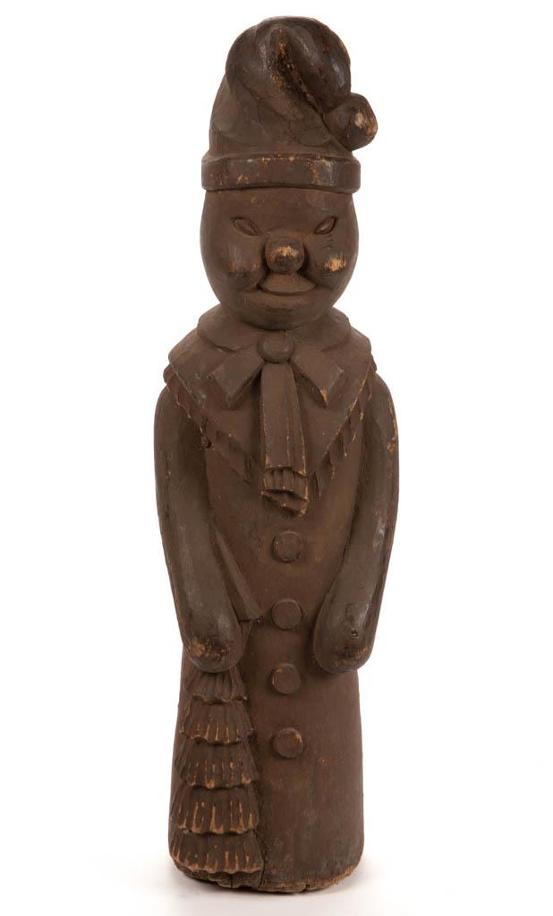 VINTAGE FOLK ART CARVING: VINTAGE FOLK ART CARVING, an elf-like creature, retaining a dry, original surface. Mid 20th century. 31" HOA.Very good overall condition with minor wear to figure and to underside of base.Provenance: