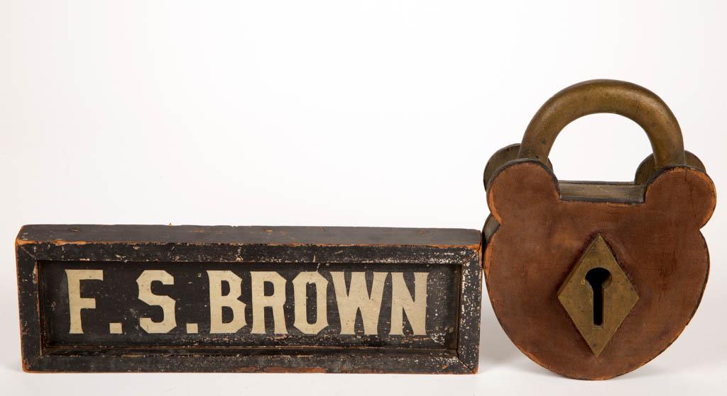 AMERICAN FOLK ART PAINTED WOOD TRADE SIGNS, LOT OF TWO: AMERICAN FOLK ART PAINTED WOOD TRADE SIGNS, LOT OF TWO, comprising one marked for "F.S. BROWN", and a lock. Each retains original painted surface. Late 19th/first quarter 20th century. Lock 9 1/4" H.V