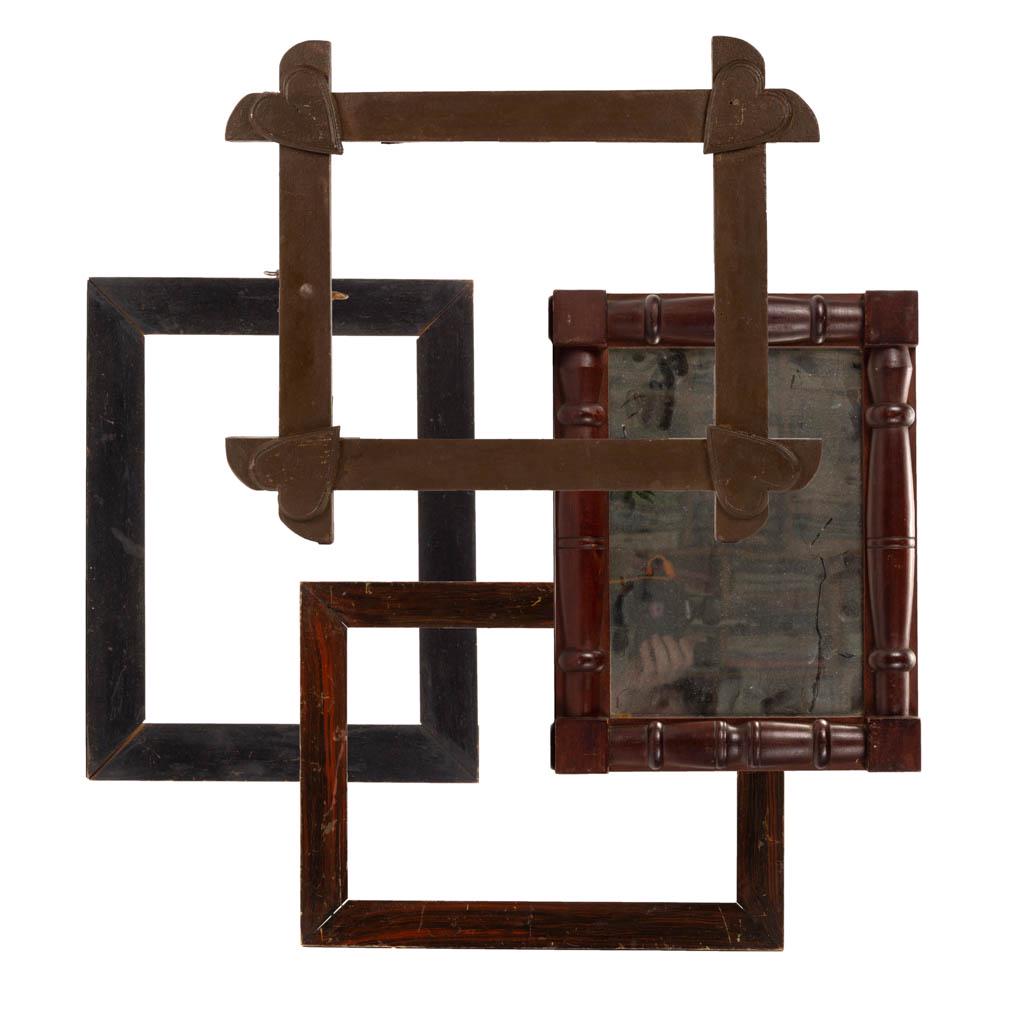 PAINT-DECORATED PICTURE FRAMES, LOT OF THREE: PAINT-DECORATED PICTURE FRAMES, LOT OF THREE, comprising a brown folk art example with applied heart motifs to corners, a black example, and a grain-painted example. Together with a wooden-framed wall