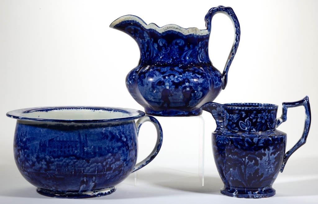 ENGLISH STAFFORDSHIRE PEARLWARE BLUE TRANSFER-PRINTED: ENGLISH STAFFORDSHIRE PEARLWARE BLUE TRANSFER-PRINTED CERAMIC ARTICLES, LOT OF THREE, comprising a chamber pot featuring transfer scene of a cathedral in background with well-dressed man and woman in