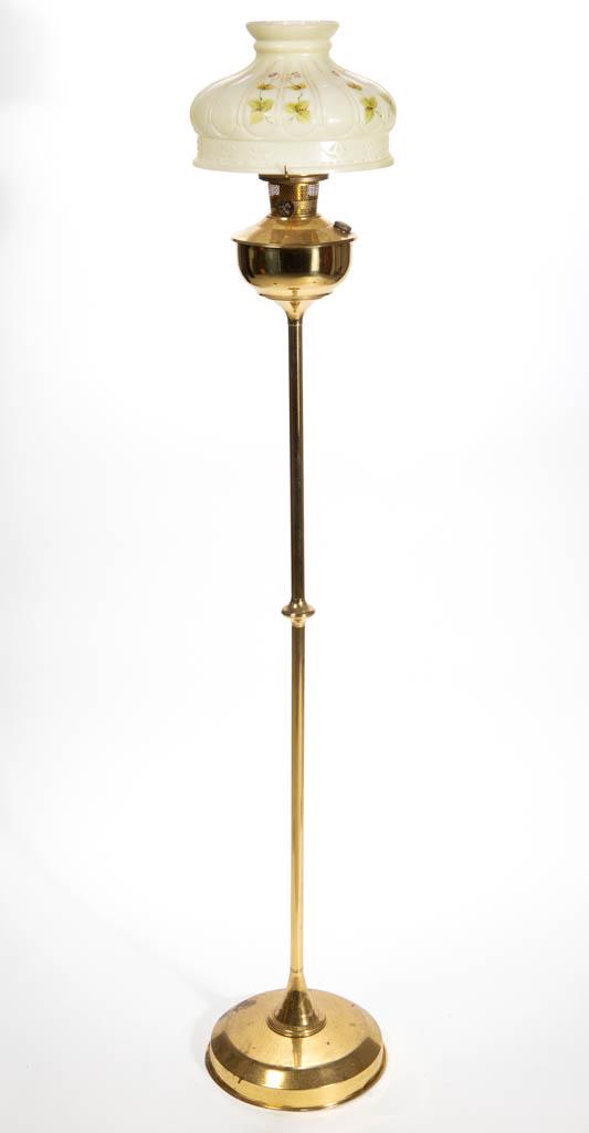 ALADDIN MODEL 23 KEROSENE FLOOR LAMP: ALADDIN MODEL 23 KEROSENE FLOOR LAMP, polished brass, attached brass font raised on a central pole with medial knop and large circular base. Fitted with a brass Model 23 burner having correct flame sp