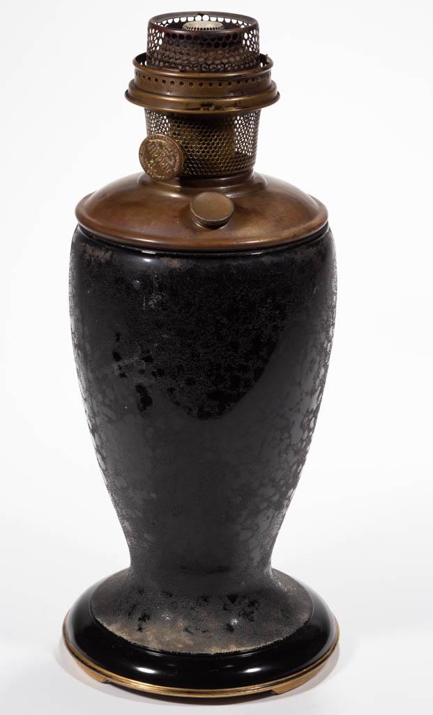 ALADDIN NO. 1248 VENETIAN ART-CRAFT KEROSENE VASE LAMP: ALADDIN NO. 1248 VENETIAN ART-CRAFT KEROSENE VASE LAMP, Ebony with a sanded texture, color fused to the interior, gilt tracing to the edge of the foot. Fitted with a brass drop-in font and complete Mo