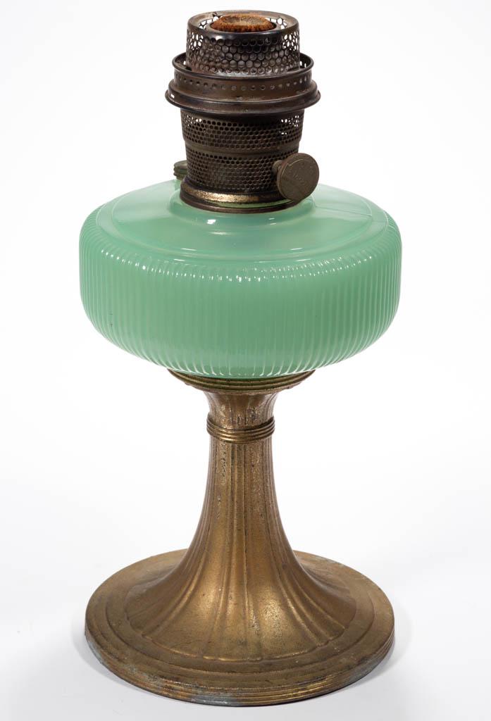 ALADDIN MODEL B-96 / QUEEN KEROSENE STAND LAMP: ALADDIN MODEL B-96 / QUEEN KEROSENE STAND LAMP, Jade Green Moonstone, ribbed font with side-refill feature and a plain edge, raised on a waisted and panelled standard and circular foot with an oxidize