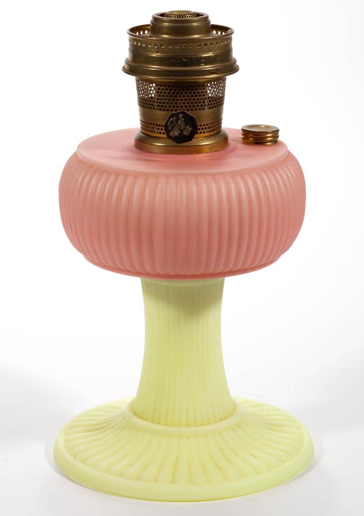 ALADDIN / FENTON GRAND VERTIQUE KEROSENE STAND LAMP: ALADDIN / FENTON GRAND VERTIQUE KEROSENE STAND LAMP, Burmese, signature to the underside has been ground off, brass collar and side refill feature with original screw-cap. Fitted with a correct brass 