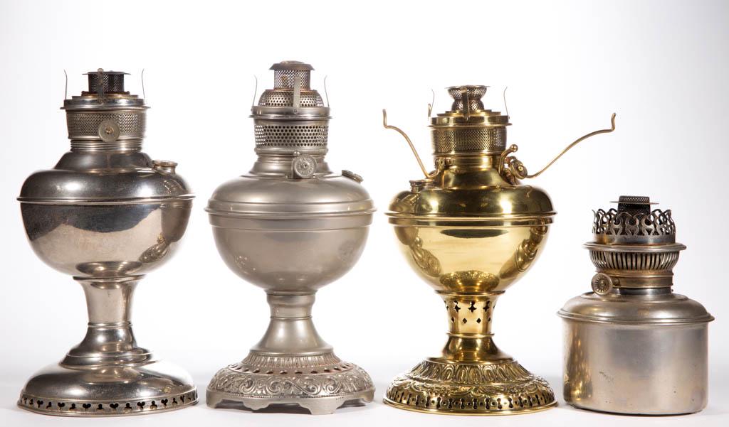 ASSORTED NICKEL AND BRASS KEROSENE LAMPS, LOT OF FOUR: ASSORTED NICKEL AND BRASS KEROSENE LAMPS, LOT OF FOUR, comprising a Rayo drop-in font, a Plume and Atwood Naugatuck, and two Miller stand lamps. Various makers. Late 19th/first quarter 20th century. 7