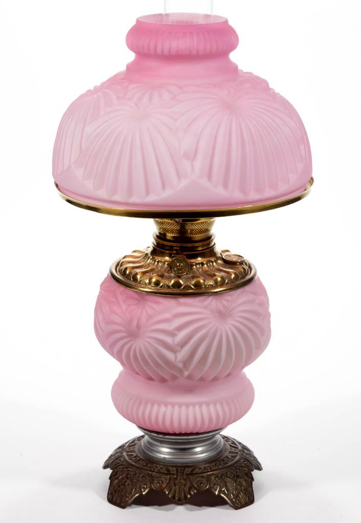 FOSTORIA NO. 52 KEROSENE GONE WITH THE WIND / PARLOR: FOSTORIA NO. 52 KEROSENE GONE WITH THE WIND / PARLOR LAMP, opal cased pink, matching pattern umbrella-form shade, waisted font vase, cast-iron foot with stippled floral ornamentation. Fitted with a pe