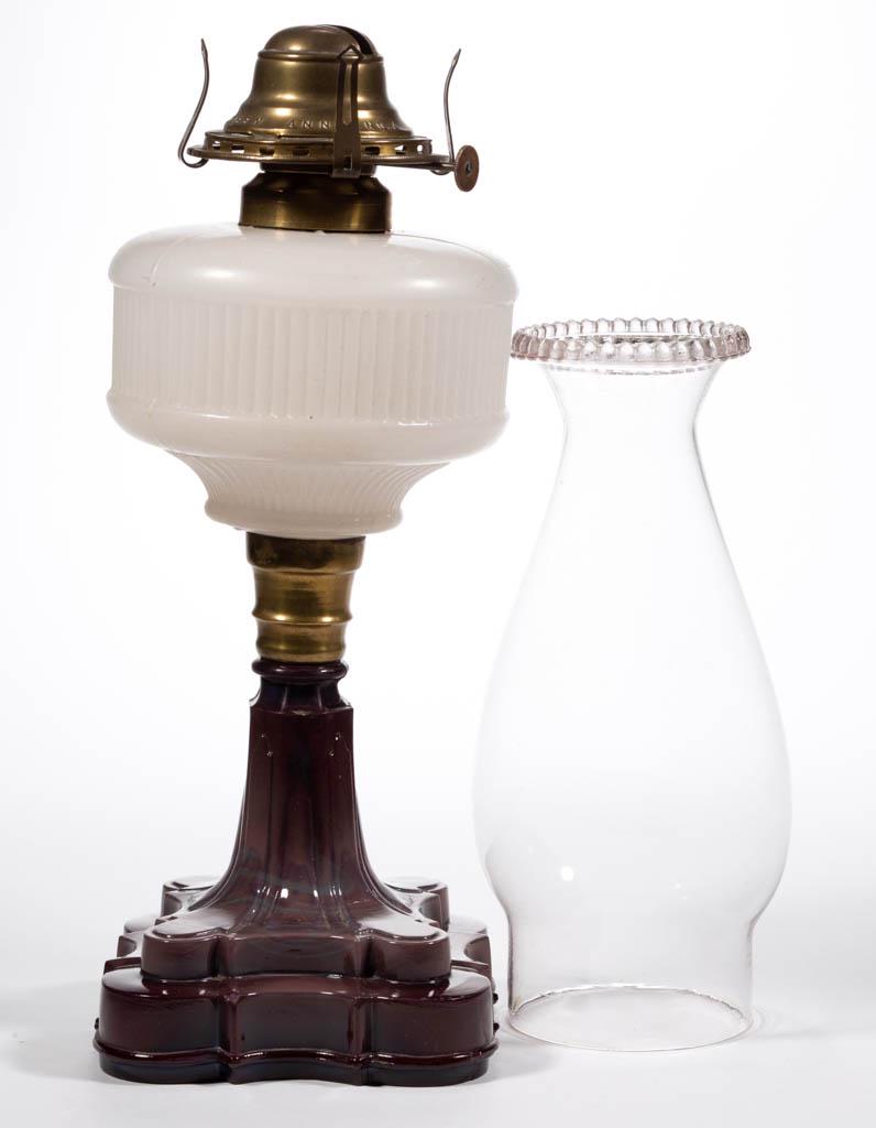 GRANT / RAND RIB KEROSENE STAND LAMP: GRANT / RAND RIB KEROSENE STAND LAMP, translucent white font with a light sanded surface, and a purple and blue slag quatrefoil base, brass connector, brass fine-line collar. Fitted with a "NO. 2 QUEE