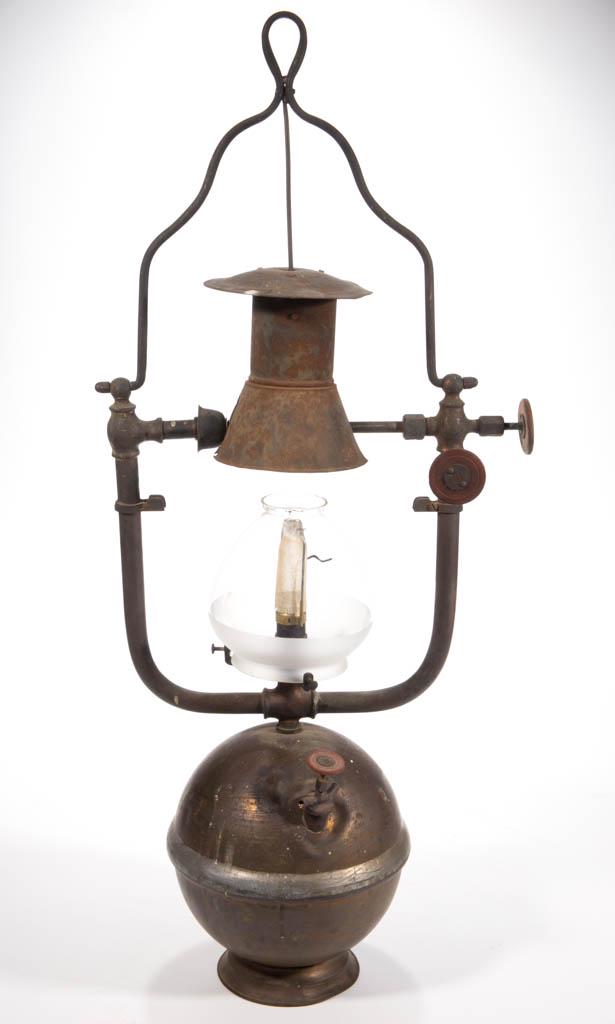 MISSOURI LAMP & MFG. "IDEAL" BRASS HANGING PRESSURIZED: MISSOURI LAMP & MFG. "IDEAL" BRASS HANGING PRESSURIZED GAS ARC LAMP / LANTERN, globular form font supported by frame, one arm fitted with two valves, font with applied makers label to underside "IDEAL