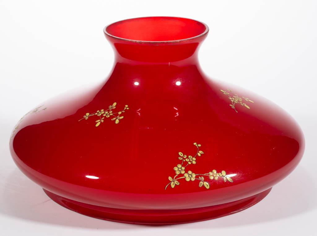 VICTORIAN ENAMEL-DECORATED GONE WITH THE WIND / PARLOR: VICTORIAN ENAMEL-DECORATED GONE WITH THE WIND / PARLOR LAMP SHADE, ruby with yellow floral enamel-decoration, umbrella form. Maker unverified. Late 19th/early 20th century. 6 1/2" H, 10" D fitter. Und