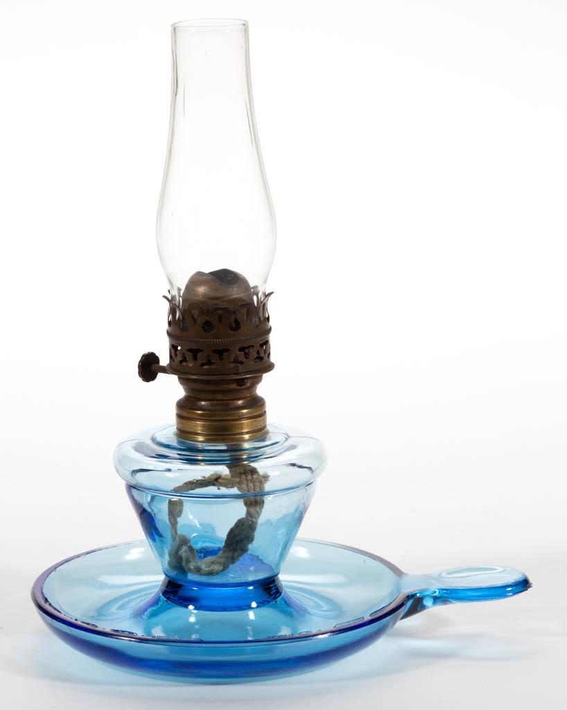 SAUCER BASE MINIATURE FINGER LAMP: SAUCER BASE MINIATURE FINGER LAMP, light blue, conical-form font with ringed shoulder, saucer base with single flat-tab handle, embossed "PAT. APPLIED FOR" to the underside of the base, period collar.