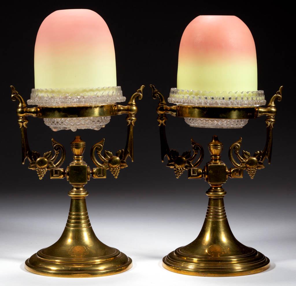 WEBB BURMESE PEDESTAL FAIRY LAMPS, PAIR: WEBB BURMESE PEDESTAL FAIRY LAMPS, PAIR, plush finish, each fairy-size dome fitted in a colorless Clarkeâ€™s lamp cup with candle holder, raised on a brass pedestal with trumpet foot. Thomas Webb