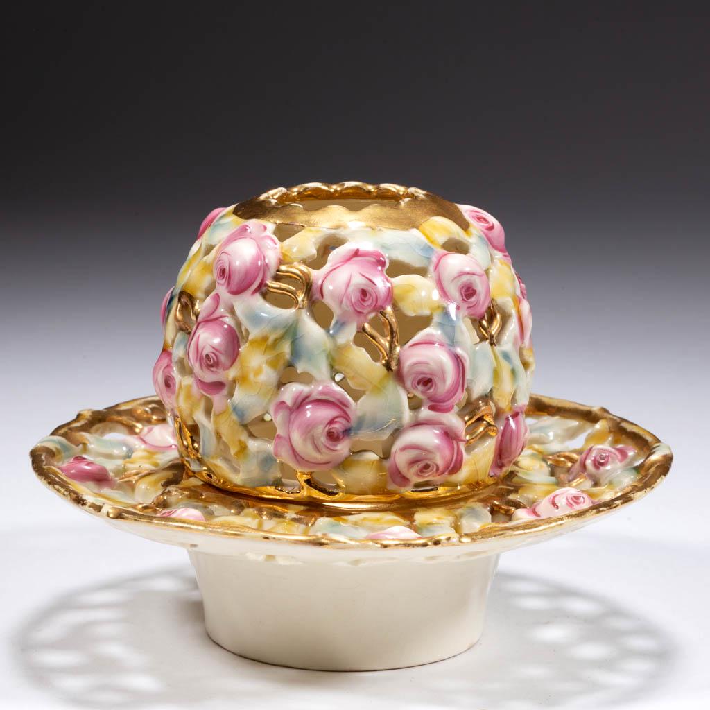 HUNGARIAN ZSOLNAY CERAMIC FAIRY LAMP: HUNGARIAN ZSOLNAY CERAMIC FAIRY LAMP, polychrome-enamel and gilt decorations, dome and base rim pierced and molded with roses and leaves. Base with "Five Churches and Family Initials" blue under-glaze