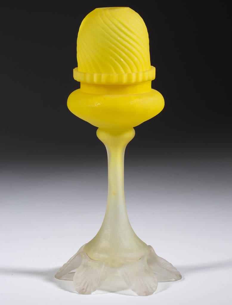 SATIN GLASS PEDESTAL FAIRY LAMP: SATIN GLASS PEDESTAL FAIRY LAMP, translucent bright yellow, embossed swirled rib pyramid-size dome with two ground air vents to bottom rim, fitted in a matching lamp cup, resting in a tall panel-optic