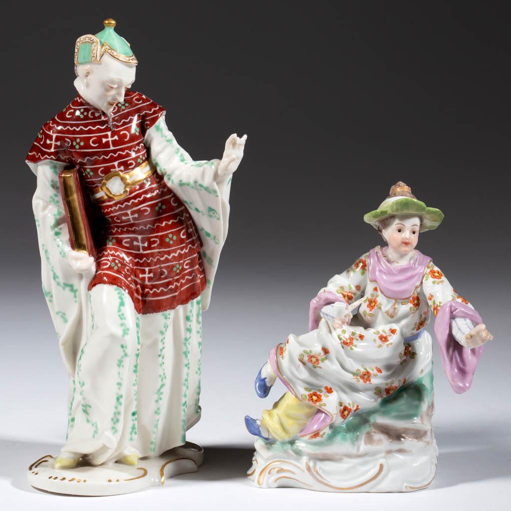 GERMAN CHINOISERIE PORCELAIN FIGURES, LOT OF TWO: GERMAN CHINOISERIE PORCELAIN FIGURES, LOT OF TWO, each having charming polychrome hand-painted decorations with gilt highlights, comprising a Chinese priest wearing long robes, holding a book in right