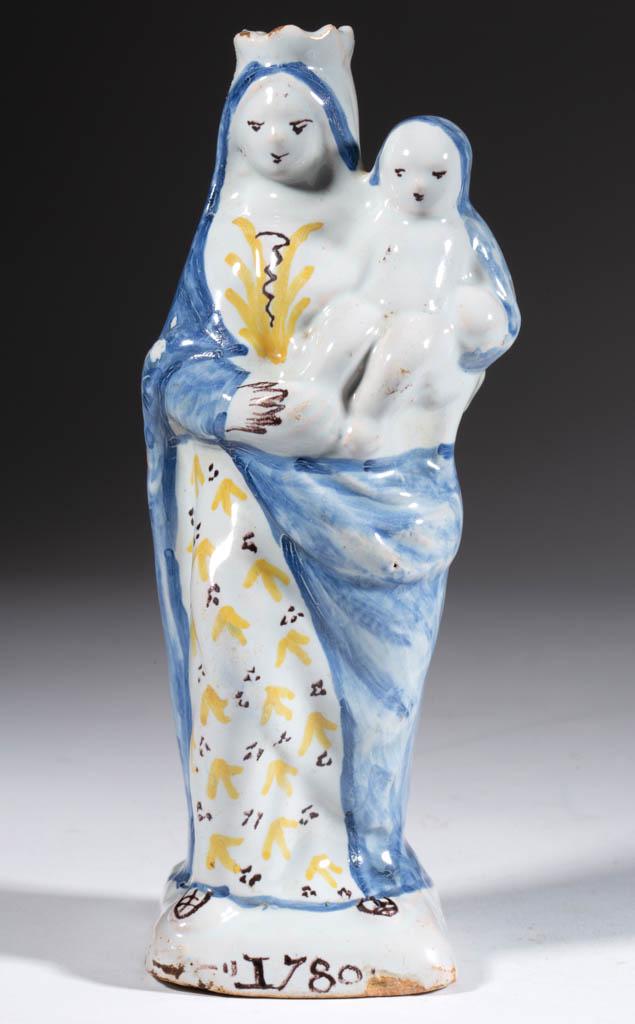 DUTCH DELFT TIN-GLAZED EARTHENWARE FIGURAL BOTTLE: DUTCH DELFT TIN-GLAZED EARTHENWARE FIGURAL BOTTLE, having polychrome hand-painted design, featuring a standing woman on a square base, wearing a crown with robes and holding a babe, having "1780" hand