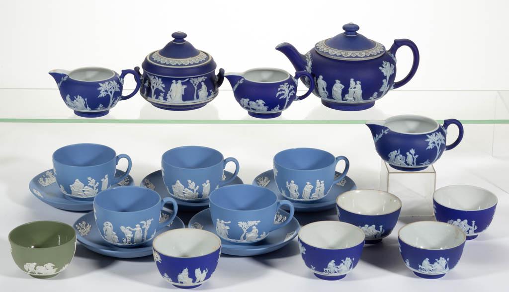 WEDGWOOD JASPERWARE CERAMIC TEA ARTICLES, LOT OF 21: WEDGWOOD JASPERWARE CERAMIC TEA ARTICLES, LOT OF 21, each having sprig molded figural and classical designs, comprising a teapot, a covered sugar, three creamers, five cup and saucer sets, five handle