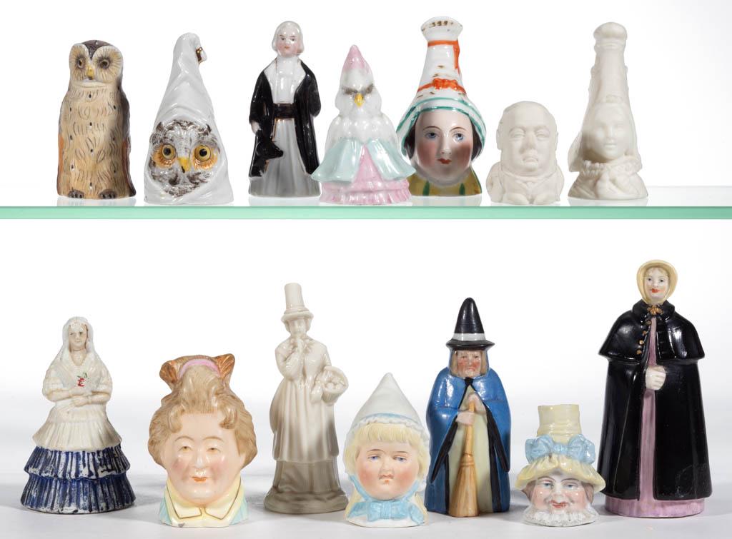 ASSORTED PORCELAIN FIGURAL CANDLE SNUFFERS, LOT OF 14: ASSORTED PORCELAIN FIGURAL CANDLE SNUFFERS, LOT OF 14, including two "Norman" girl examples with pointed cap, two owl examples including one full-bodied and one wearing a sleeping cap, one "Witch" exa