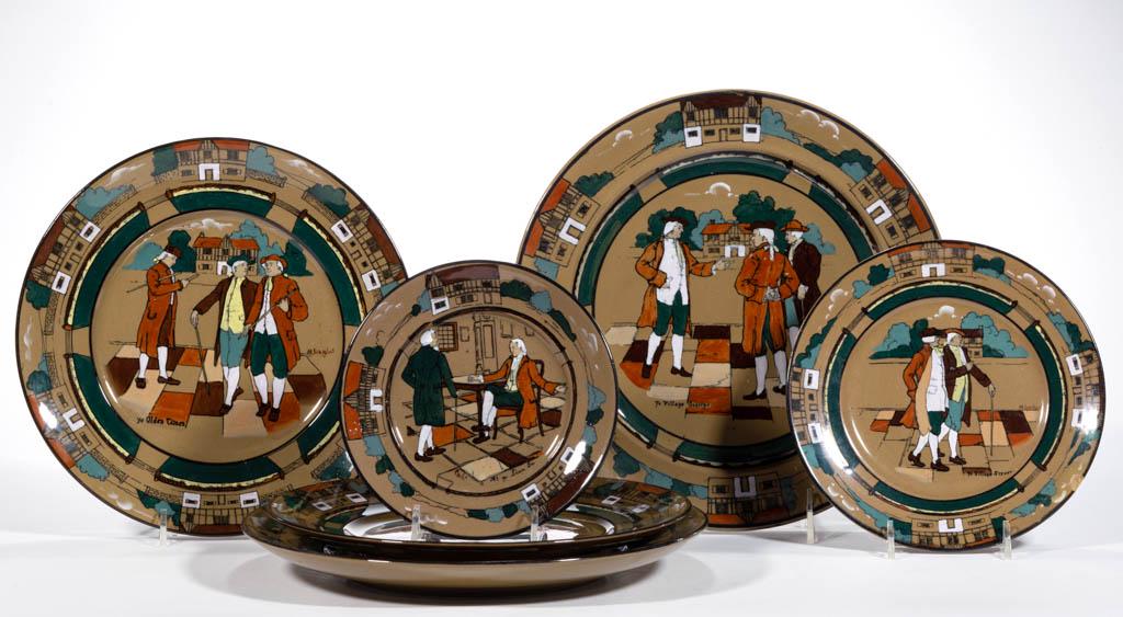 AMERICAN BUFFALO POTTERY DELDARE "YE OLDEN DAYS": AMERICAN BUFFALO POTTERY DELDARE "YE OLDEN DAYS" CERAMIC PLATES, LOT OF SIX, each featuring images of men in colonial period dress with house borders, comprising two having "Ye Village Gossips" scene,