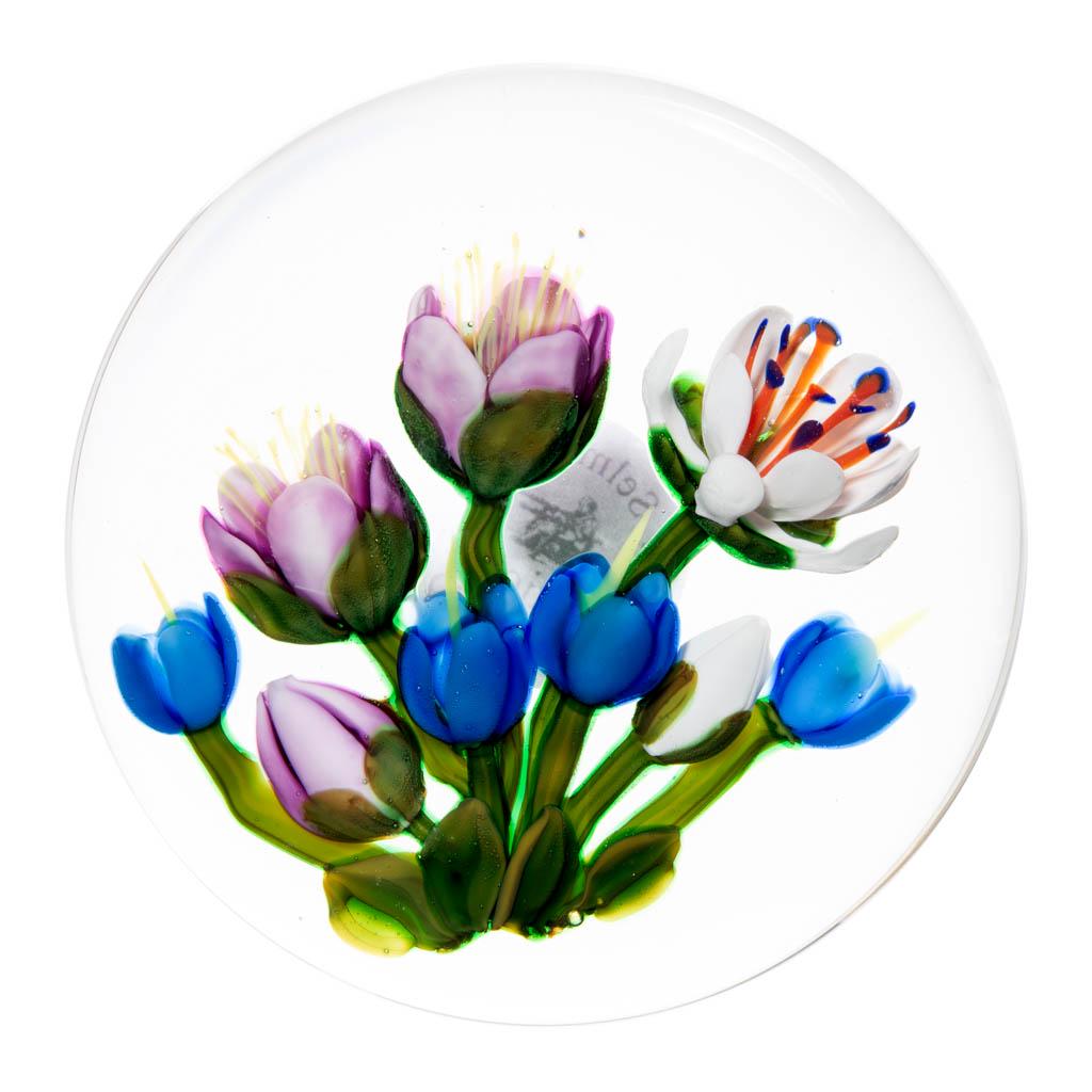 KEN ROSENFELD FLORAL LAMPWORK STUDIO ART GLASS: KEN ROSENFELD FLORAL LAMPWORK STUDIO ART GLASS PAPERWEIGHT, colorless, comprising nine flowers, three pink, four blue, and two white, with four green leaves to the base, signed to the side "Ken Rosenf