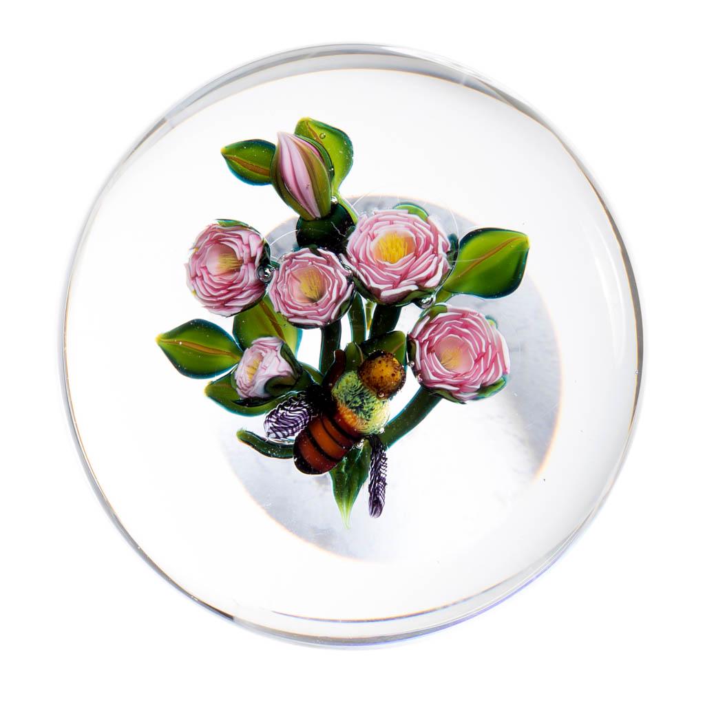 KEN ROSENFELD FLORAL LAMPWORK STUDIO ART GLASS: KEN ROSENFELD FLORAL LAMPWORK STUDIO ART GLASS PAPERWEIGHT, colorless, depicting a bee pollination a pink Clichy-style bouquet with five blooms, a bud, and seven leaves, signed "KR 2009" and an R-sign