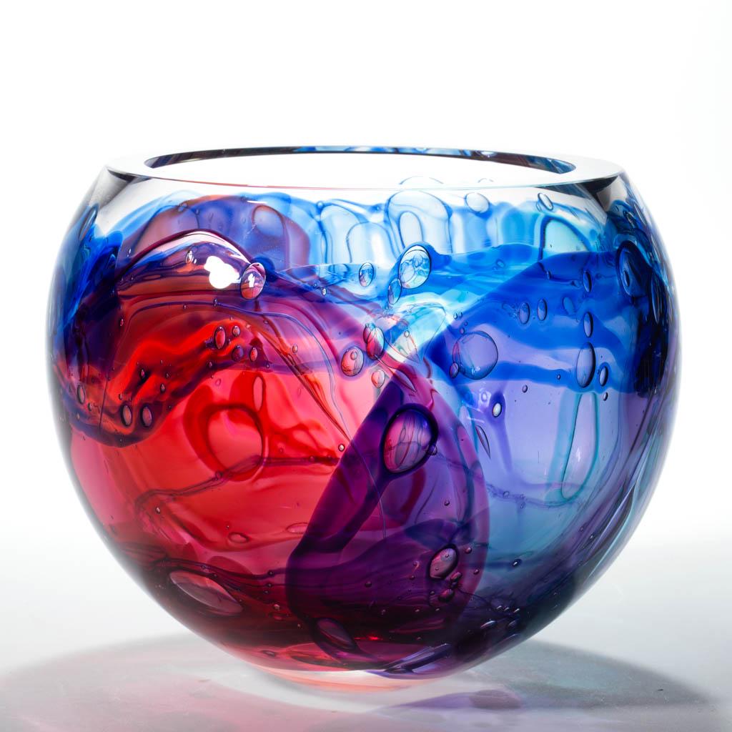 LEON APPLEBAUM STUDIO ART GLASS LAVA BOWL: LEON APPLEBAUM STUDIO ART GLASS LAVA BOWL, colorless with polychrome swirled decoration, polished rim and base, signed "Leon Applebaum". 21st century. 8 1/4" H, 8 1/4" D rim.Undamaged.Provenance: From