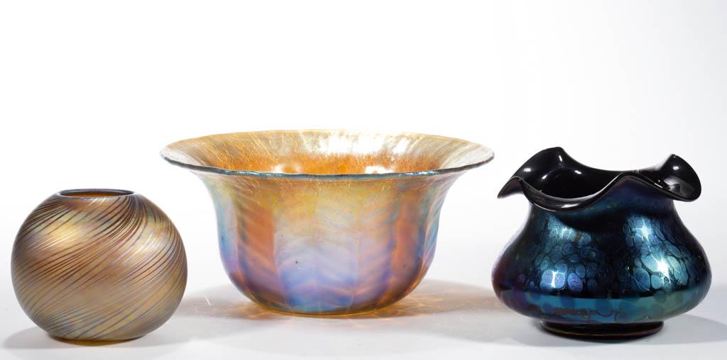 ASSORTED IRIDESCENT STUDIO ART GLASS ARTICLES, LOT OF: ASSORTED IRIDESCENT STUDIO ART GLASS ARTICLES, LOT OF THREE, comprising a Feather-Optic bowl with a spurious Tiffany signature, a golden iridescent swirl rose bowl with a spurious Tiffany paper label,
