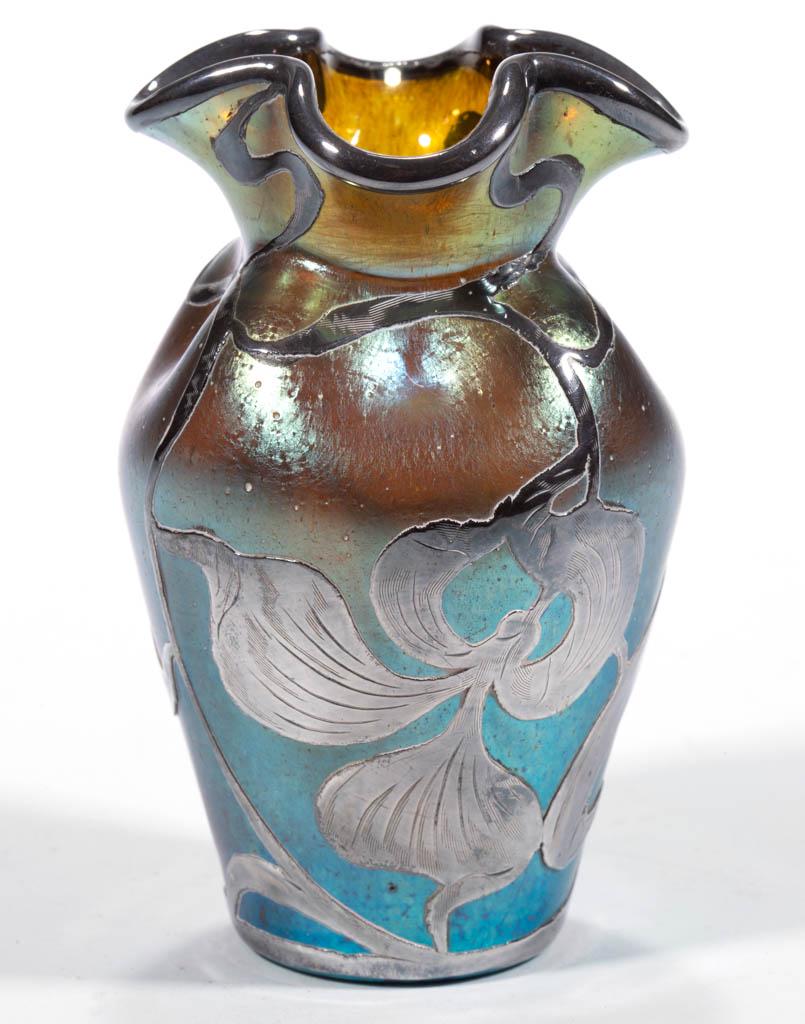 LOETZ ATTRIBUTED IRIDESCENT ART GLASS - SILVER-OVERLAY: LOETZ ATTRIBUTED IRIDESCENT ART GLASS - SILVER-OVERLAY VASE, green iridescent, quatrefoil rim with a tapered body, silver-overlay rim and floral overlay to the body. Bohemia, now Czech Republic. First