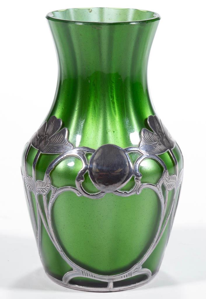 LOETZ ATTRIBUTED METALLIN ART GLASS - SILVER-OVERLAY: LOETZ ATTRIBUTED METALLIN ART GLASS - SILVER-OVERLAY CABINET VASE, cased green, tapered form with a waisted neck, floral overlay decoration, factory-polished rim. Bohemia, now Czech Republic. First qu